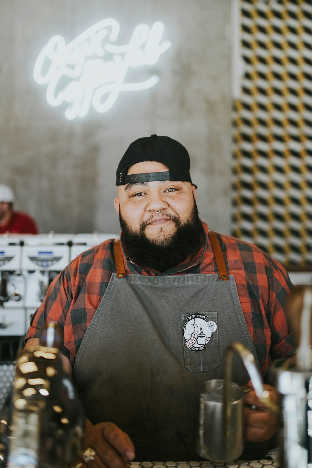 Photo by Brooke Cagle man in black and orange vest wearing black knit cap